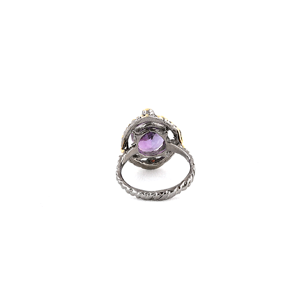 Back view of silver ring with amethyst and red sapphire